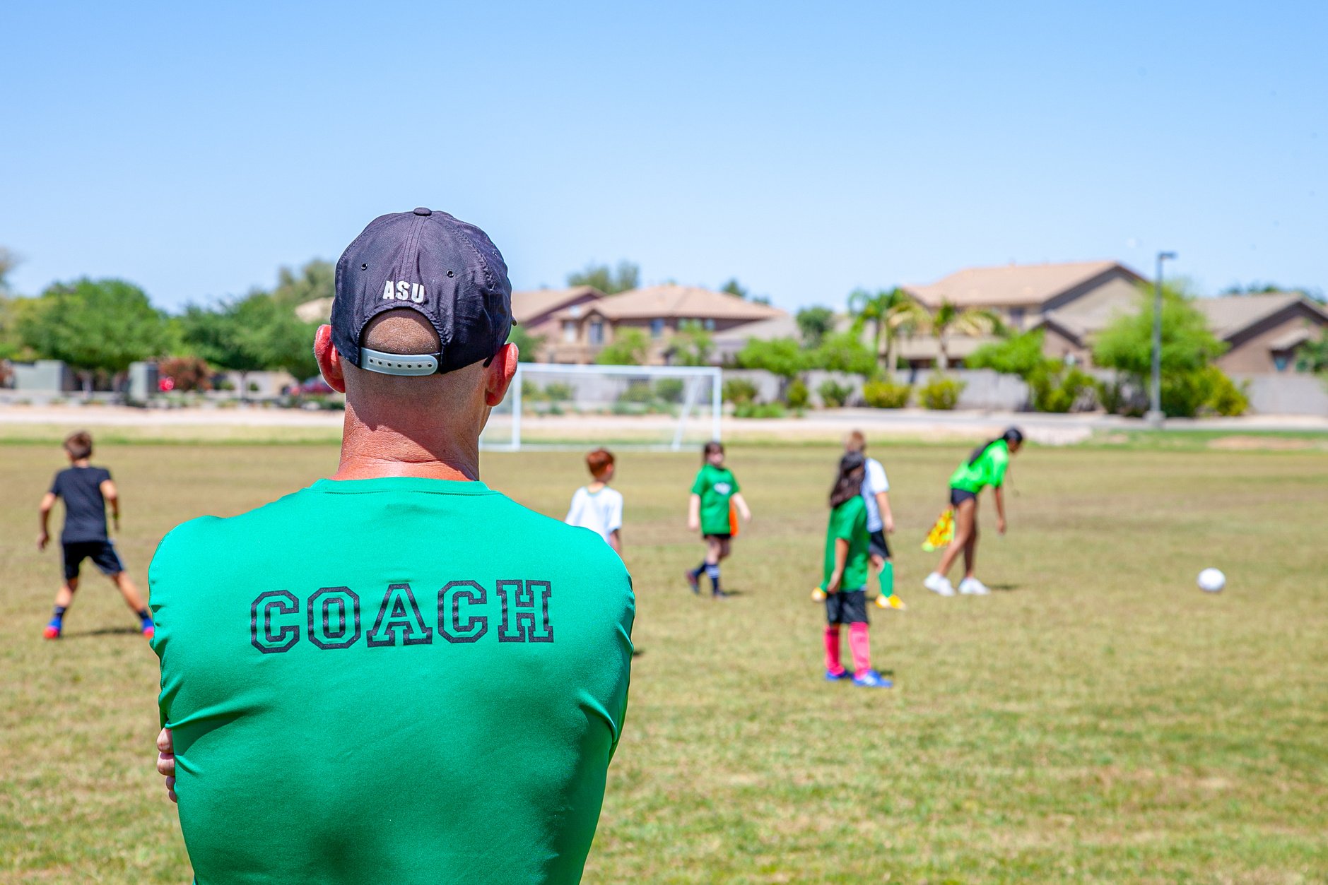 A Coach Looking his Soccer Players